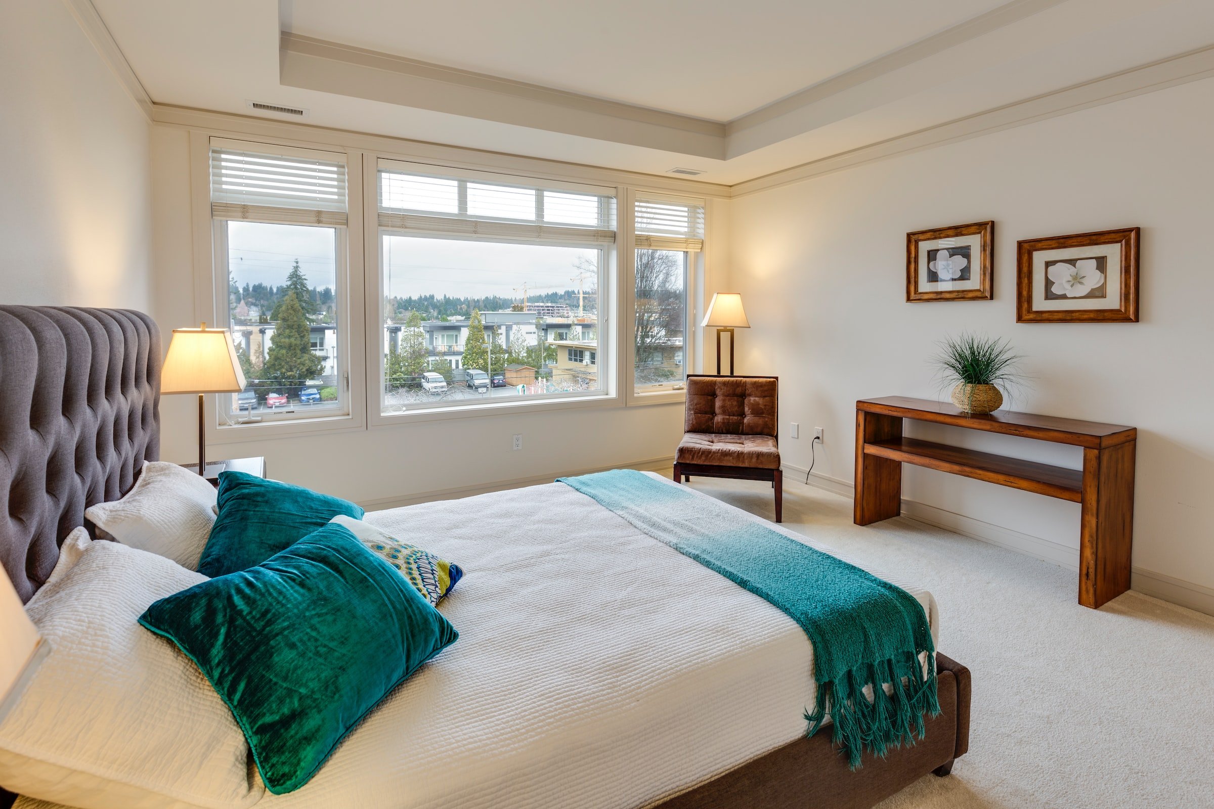 Bright bedroom with light carpet floors